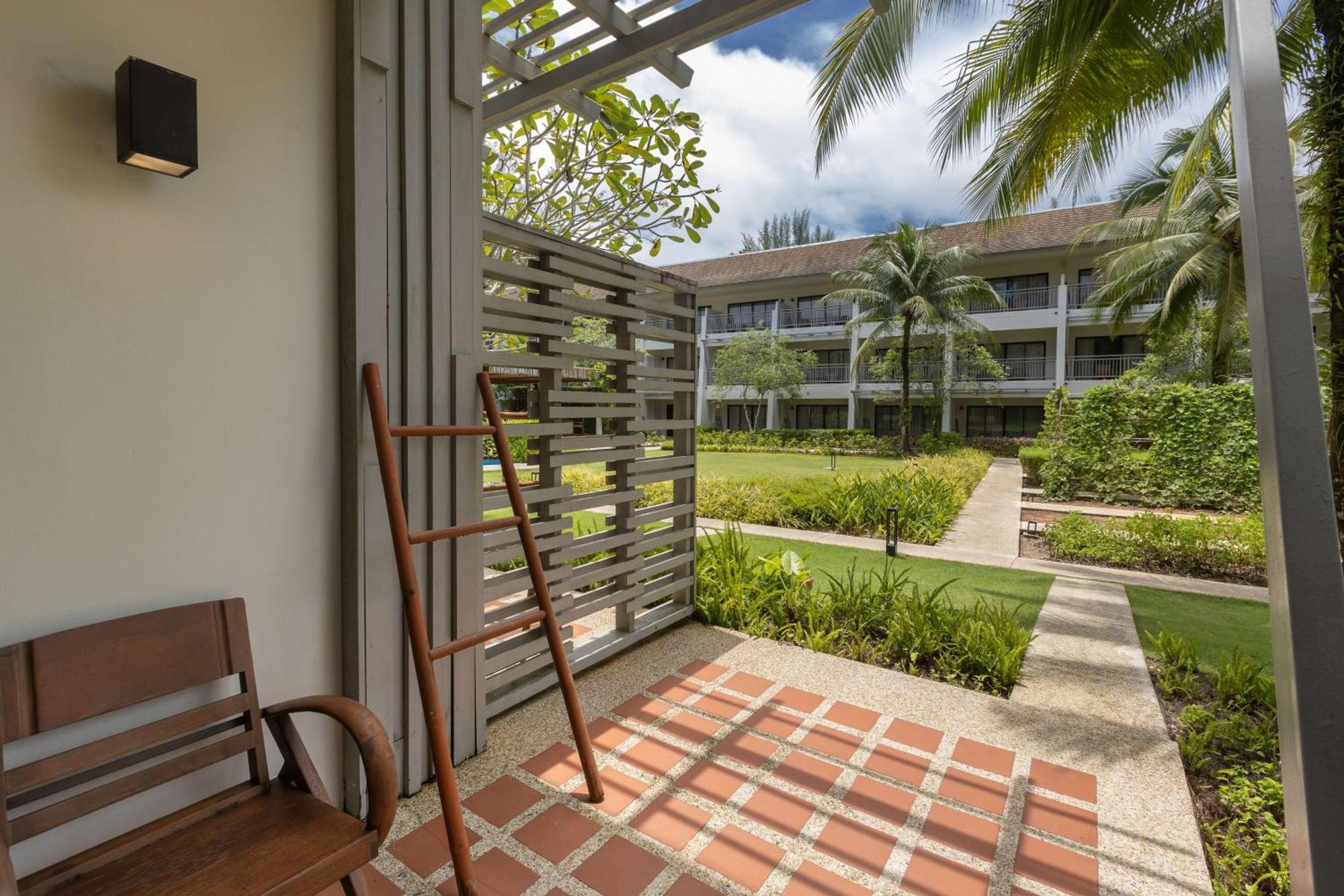 Outrigger Khao Lak Beach Resort - Sha Extra Plus 외부 사진 A view of the hotel's grounds from a guest room
